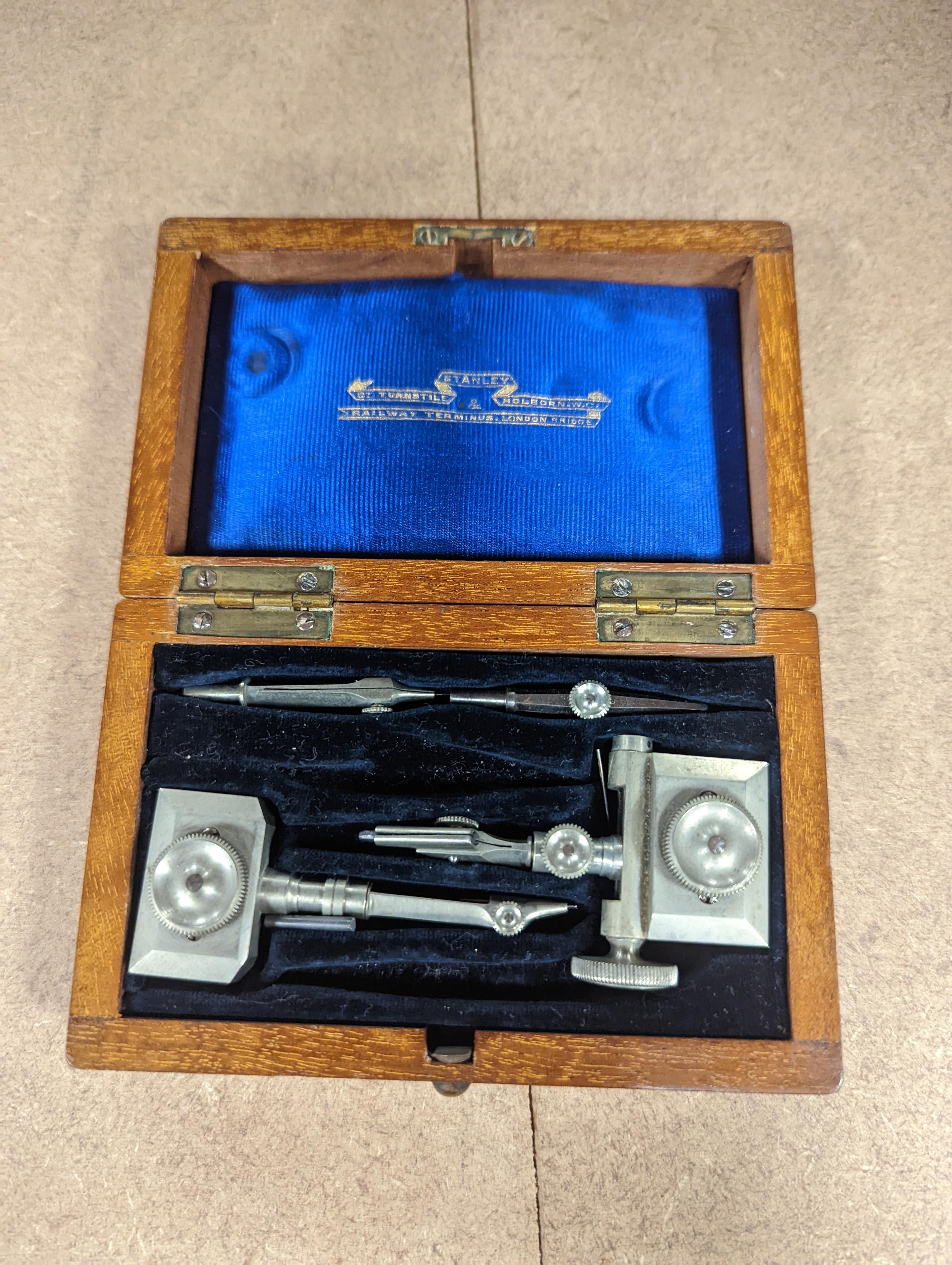 A collection of mahogany cased drawing instruments (8)